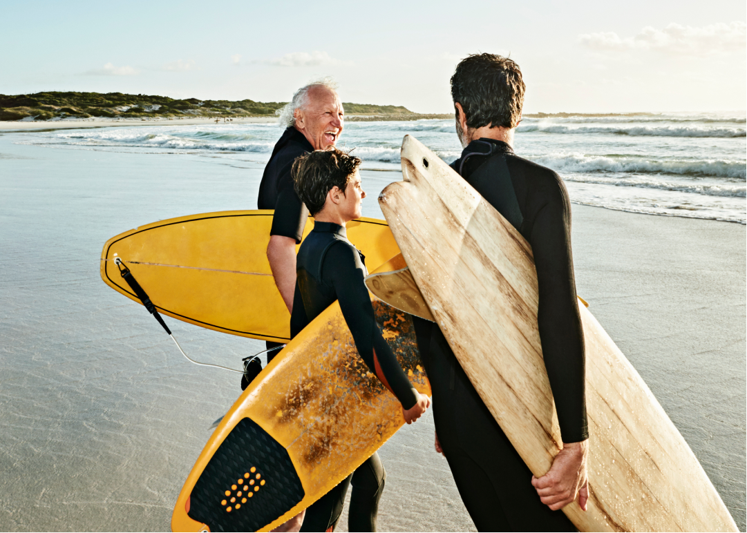 Family of surfers on beach